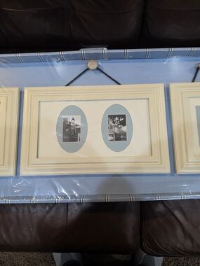Fetco Cream Triple-Opening Wall Frame with Blue Mats